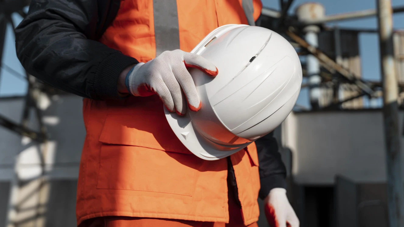 close up hand holding safety helmet v3